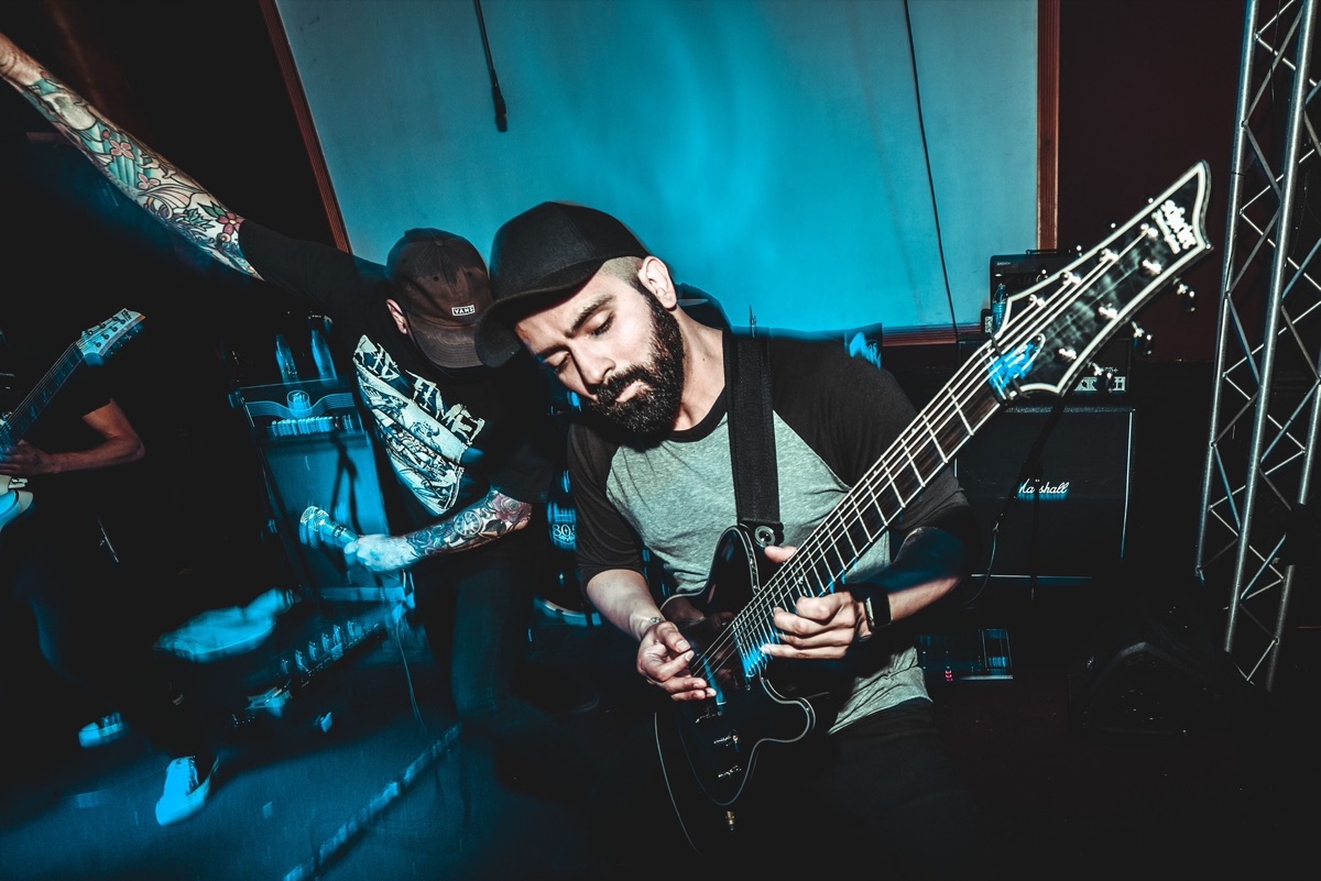Jesse Moraga playing guitar live