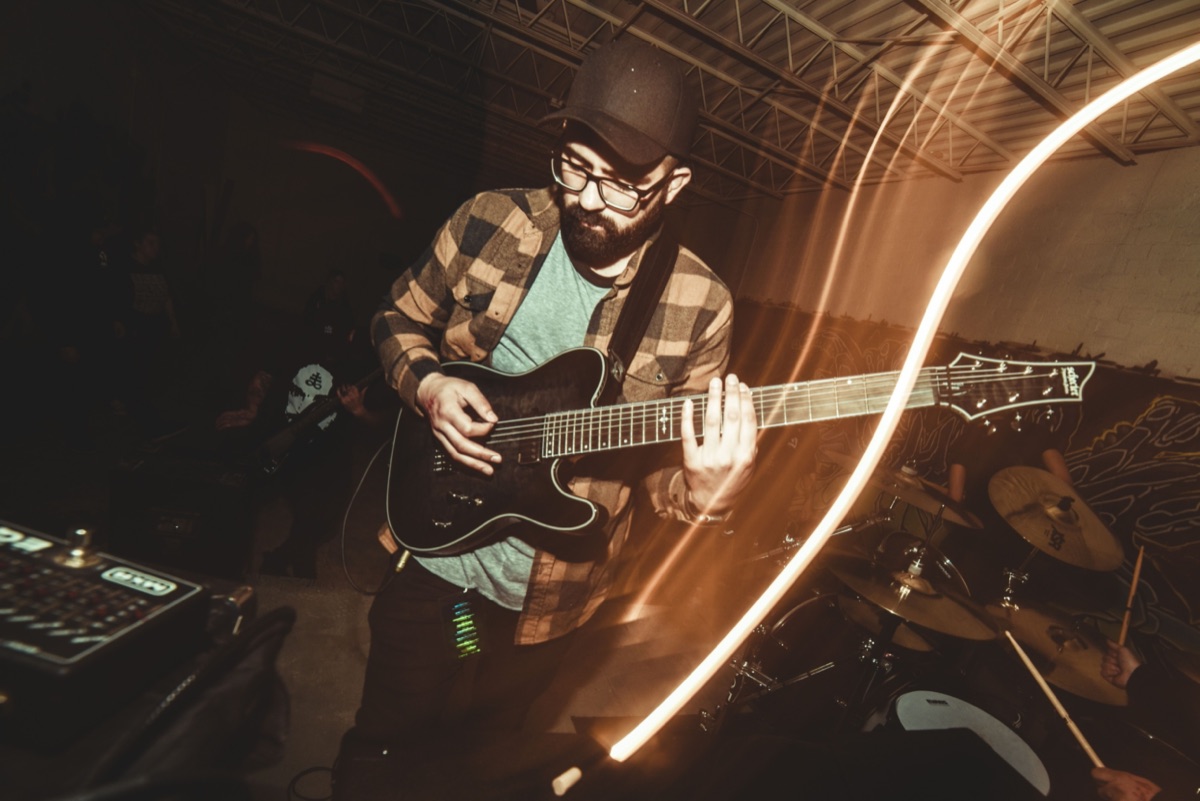 Jesse Moraga playing guitar live